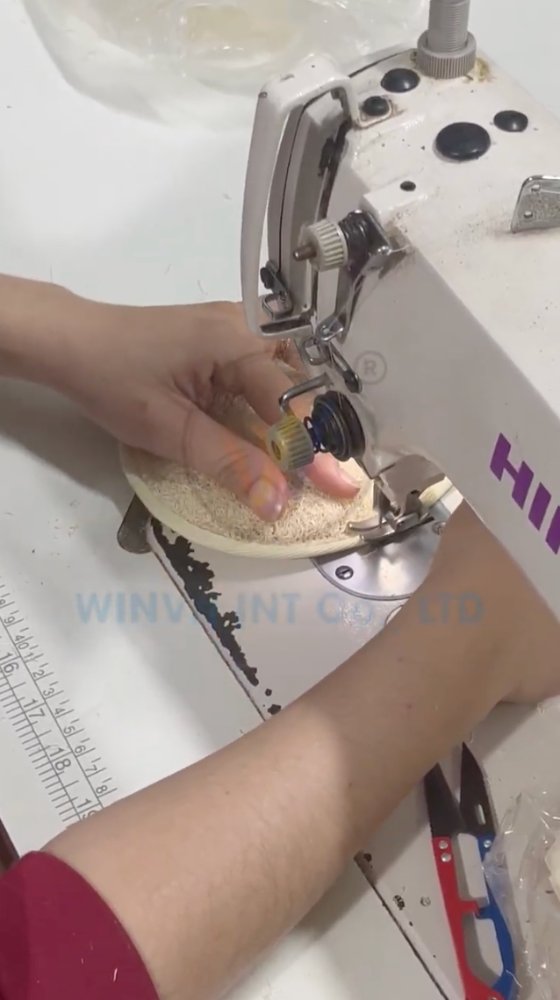 Hand-sewing natural loofah fiber into a finished sponge shape